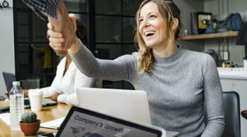 woman smiling and shaking hands