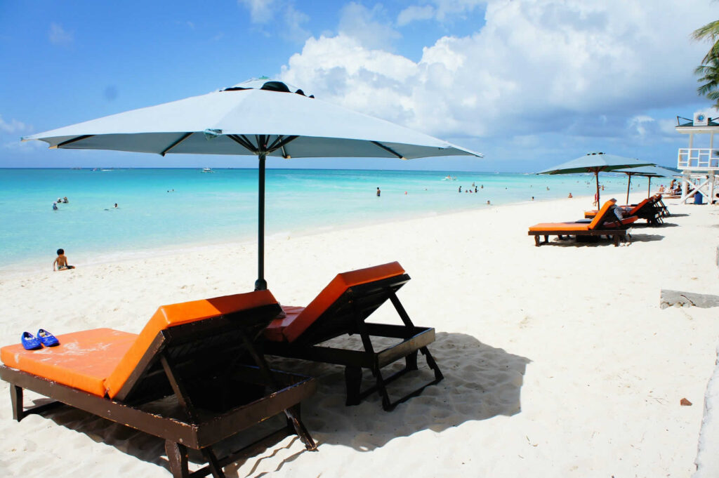 Beach chairs along the Caribbean beach. The average Social Security payment in 2025 won't support this retirement lifestyle