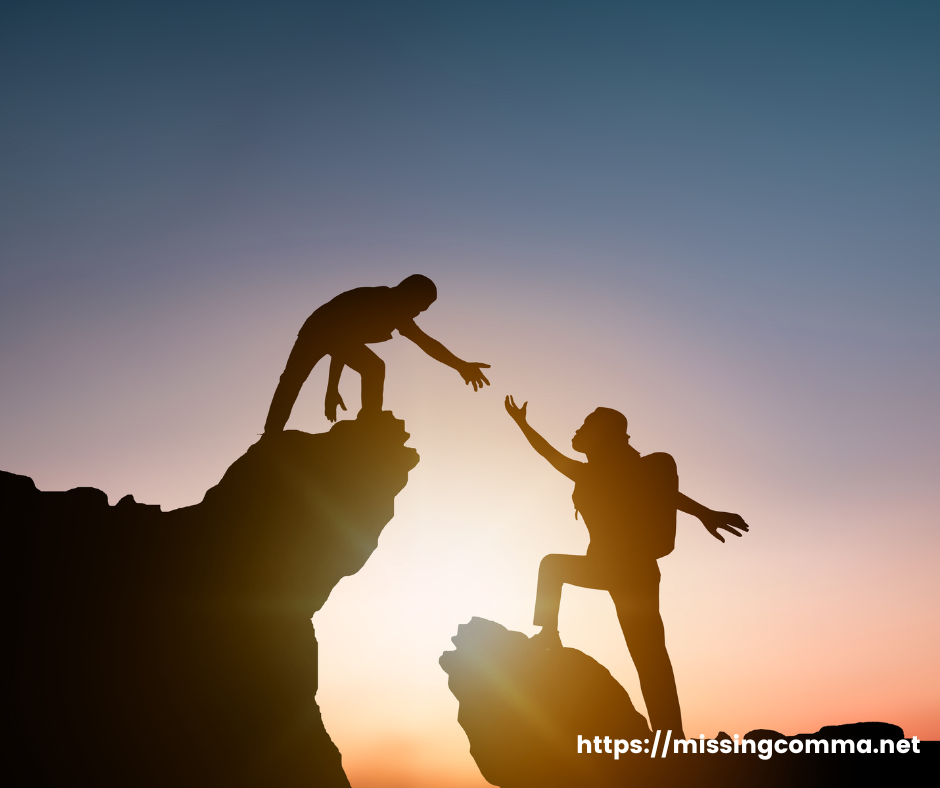 two people giving a helping hand up the mountian